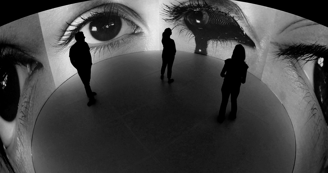 Visitors embrace the immersive experience within the 360 room installation